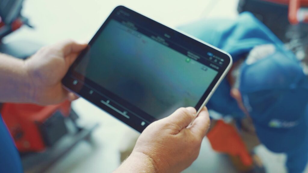 Lakeside Pro Services employee doing a camera inspection with tablet.